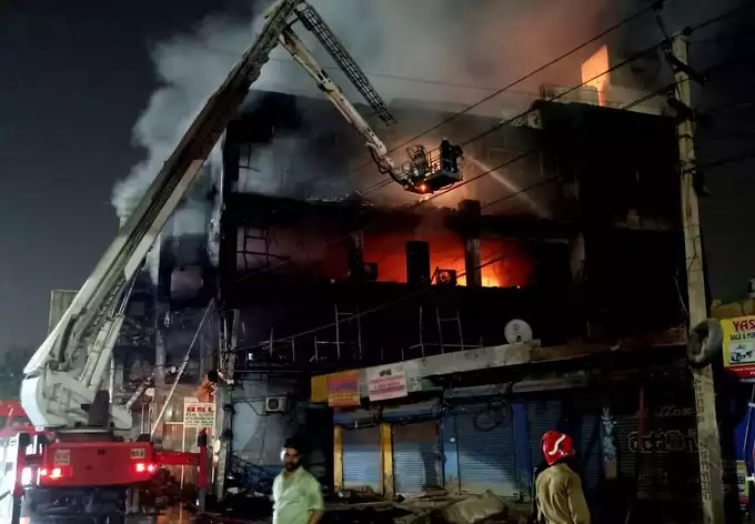 Fire breaks out in CCTV camera warehouse in three storey building 27 dead 12 serious 3