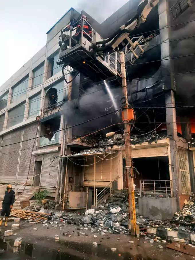 Fire breaks out in CCTV camera warehouse in three storey building 27 dead 12 serious 5