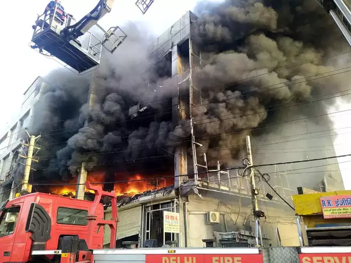 Fire breaks out in CCTV camera warehouse in three storey building 27 dead 12 serious 2